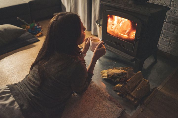 A woman in her comfort zone keeping herself warm